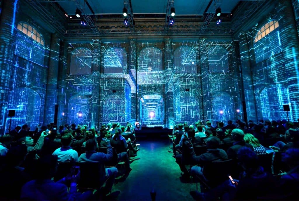 A dynamic live events with cutting-edge AV technology, featuring vibrant video walls, immersive lighting, and high-quality sound systems