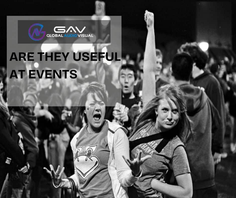 Interactive Displays & Touchscreens at an event booth with people engaging in games, presentations, and team activities.