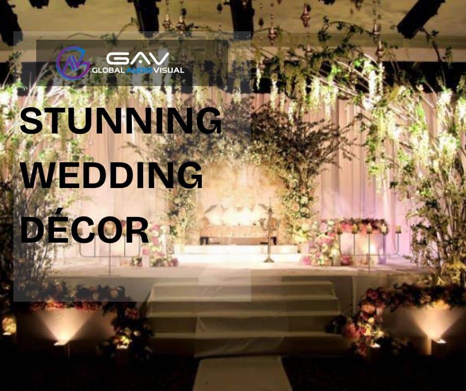 Stunning wedding décor featuring LED walls and projection mapping with glowing aisle flowers, elegant lighting, and floral centerpieces under soft spring wedding colors.