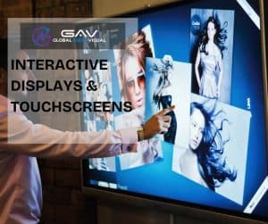 Interactive Displays & Touchscreens at an event booth with people engaging in games, presentations, and team activities.